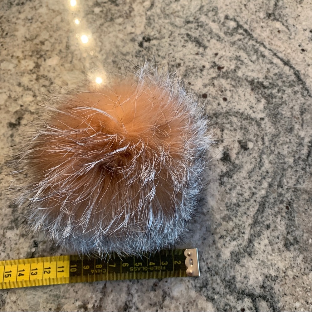 Real fur PomPom can be attached on a hat or anything else